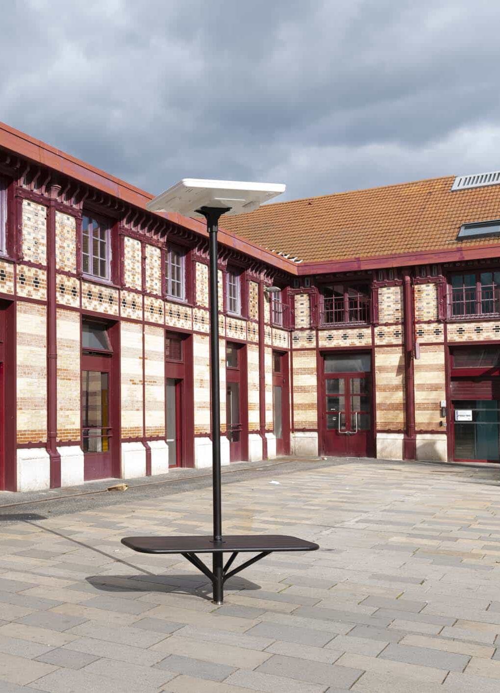red building with solar light out front