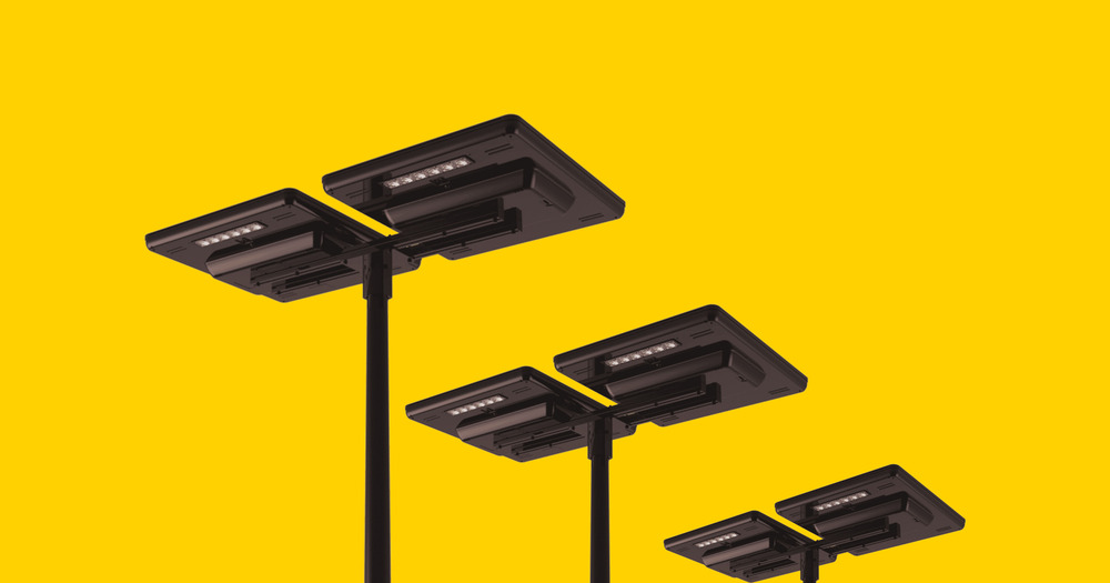 A line of Sol's black Maxi-4 roadways lights displayed against a yellow background