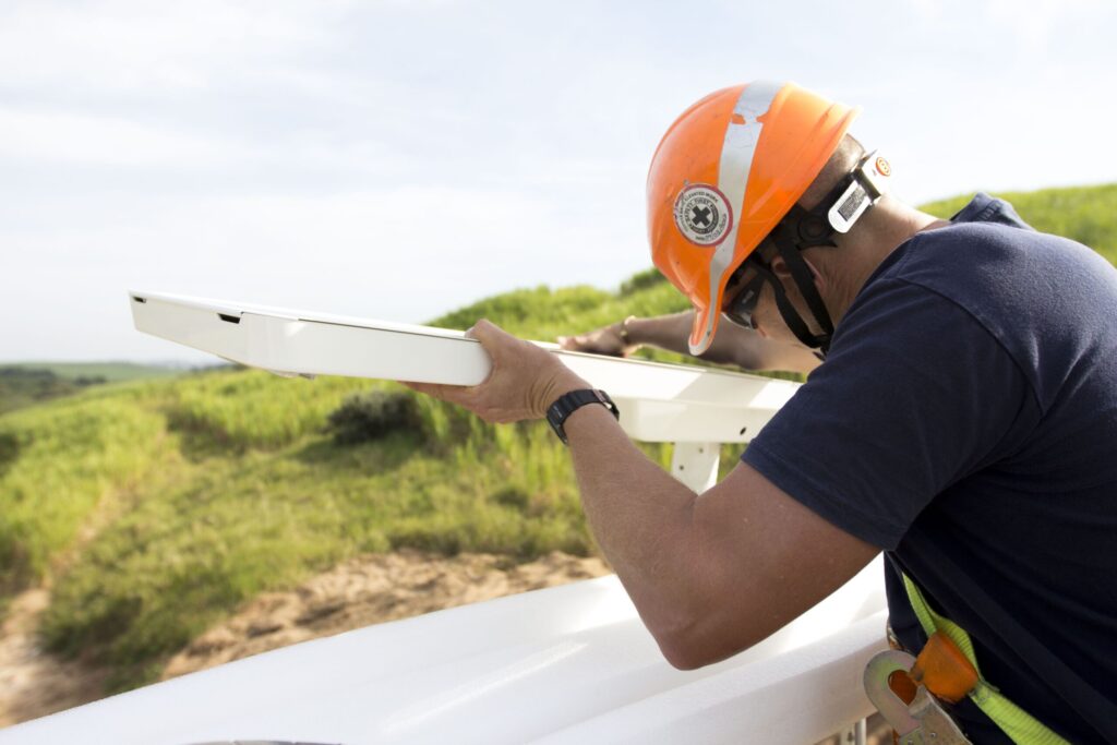 Solar lighting installer with orange hat