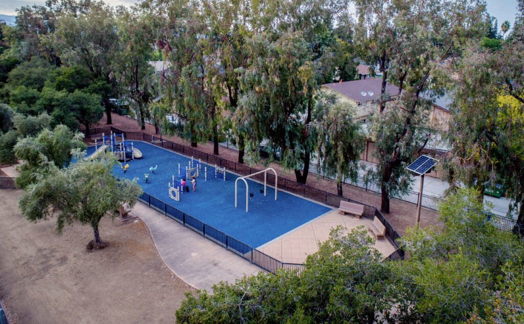 aerial image of park playground surrounded by neighborhood and trees