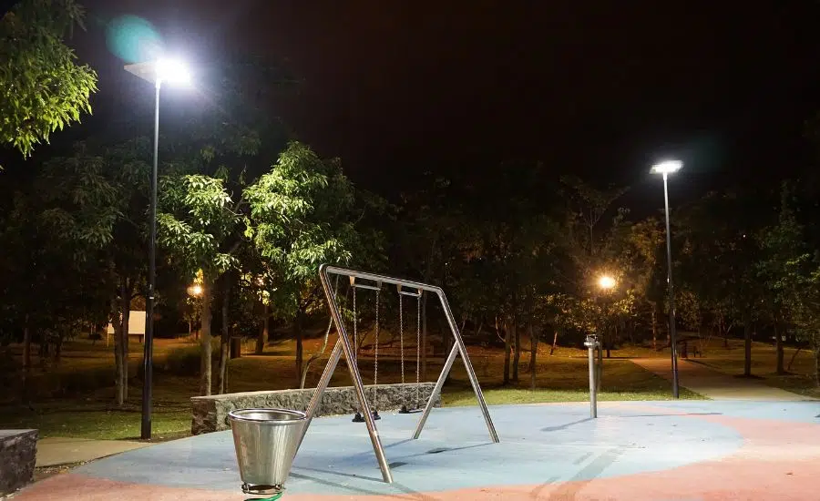 image of swing set at night light up by Sol's iSSL solar lights