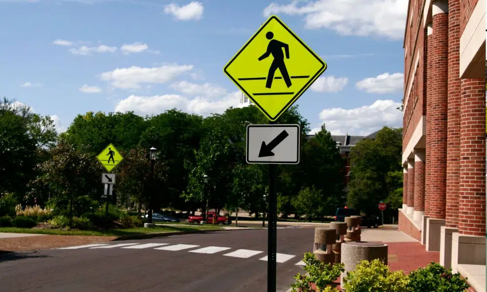 midblock crosswalk with fluorescent signage and pavement markings