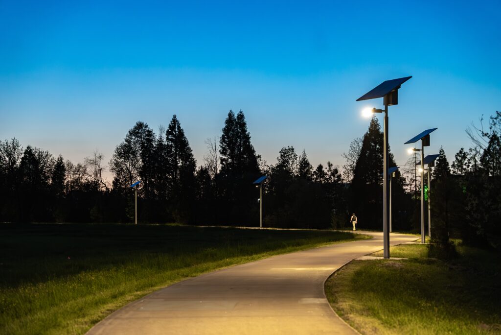 paved pathway at dusk with solar lighting