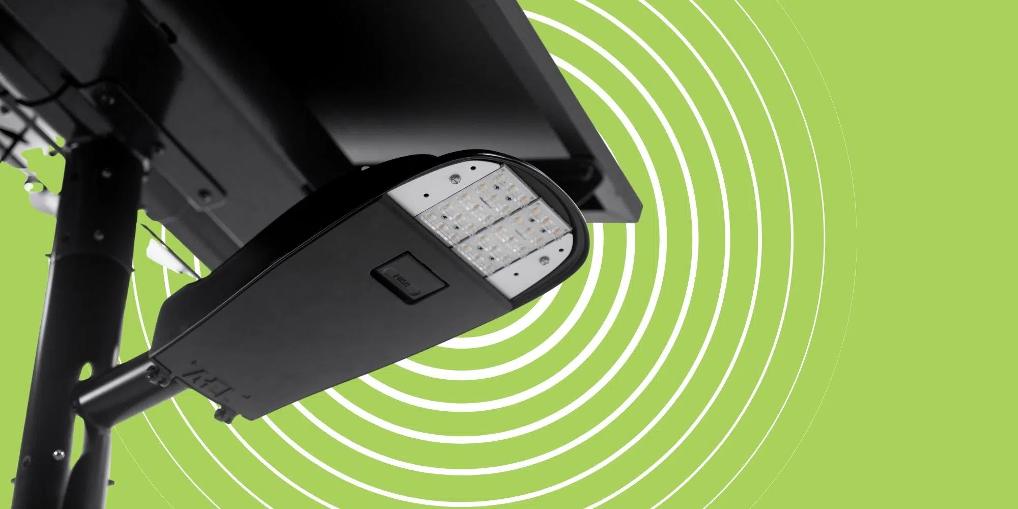 Close-up of fixture on a solar light with green background and concentric white circles
